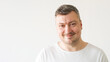 © golubovy - Positive man. Good morning. Enjoying moment. Handsome satisfied smiling guy in white t-shirt on light background.