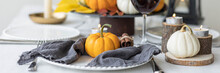 Idea For A Beautiful Autumn Setting For Thanksgiving Family Dinner Or Wedding. Orange Pumpkin As Decor. Cozy Fall Home Atmosphere. Banner Copy Space For Text