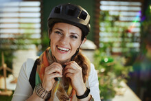 Smiling Elegant Business Woman In Bike Helmet In Eco Office