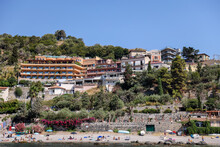 Taormina, Italy - July 22, 2022: The Rocky Seaside And Coastline Below Taormina In Sicily
