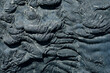 Oil tar frozen in waves, texture black rough background