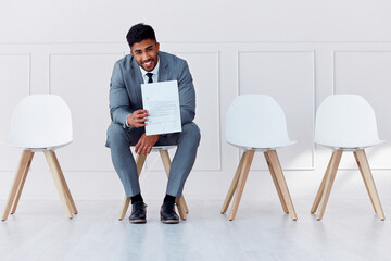 Wall Mural - Hiring, recruitment and business man in a waiting room for a corporate company job interview. Happy, smile and confident career businessman with professional cv ready for job, interview or recruiting