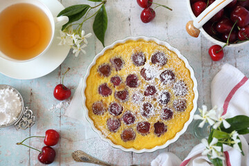 Wall Mural - Cherry clafoutis ang cup of Jasmine tea, french cuisine