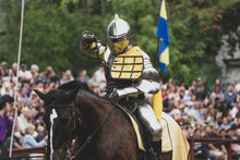 Unknown Knight In A Suit Of Armor Is Riding On A Horse And Ready For Battle