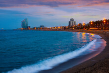 Picturesque Seascape Of Summer Barceloneta Beach On Mediterranean Coastline In Barcelona With Luxury Hotel W Barcelona In Background At Sunset, Spain