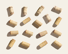 Wine Corks As Creative Square Pattern On Beige Background With Hard Light And Shadows At Sunlight. Minimal Layout With Bottle Stoppers From Red White Wine, Top View, Pastel Colors Summer