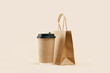 Takeaway paper coffee cup with lunch bag on beige. Snack delivery service. Coffee to go. Grab and go or carry out beverage. Disposable mockup packaging. Place for text. Minimal