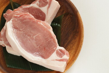 Raw pork on wooden plate for cooking ingredient