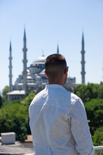 Unrecognizable Man Gazing At The Blue Mosque In Istanbul, Turkey
