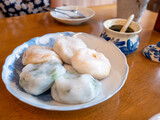 Fototapeta  - Various Chinese dumpling with seasoning on wooden table