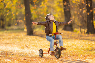 Poster - Happy child having fun outdoor in autumn park