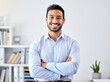 © Mumtaaz Dharsey/peopleimages.com - Portrait of a businessman with a smile in a corporate modern office of a startup company. Happy, career and professional manager or entrepreneur standing with his arms crossed in his workspace.