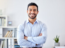 Portrait Of A Businessman With A Smile In A Corporate Modern Office Of A Startup Company. Happy, Career And Professional Manager Or Entrepreneur Standing With His Arms Crossed In His Workspace.