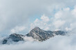 © Westend61 - Beautiful view of mountains covered by clouds