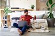 © Westend61 - Businessman having coffee and feeding dog at home