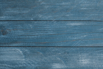 
Vintage blue wood background texture with knots and nail holes. Old painted wood wall. Blue abstract background. Vintage wooden dark blue horizontal boards. Front view with copy space. 