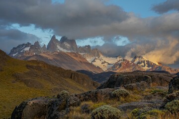 Wall Mural - Beautiful scenery of a mountainous landscape enveloped in clouds in a rural area