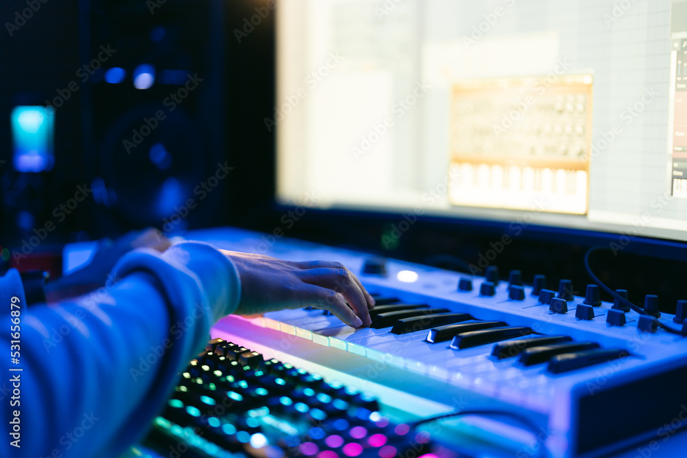 Producer, audio engineer uses a control panel and screen to record a ...