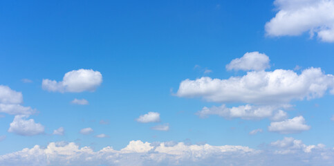 Wall Mural - Clear blue sky background with white clouds