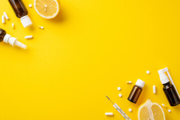 Wall Mural - Illness concept. Top view photo of medicines transparent brown bottles pills capsules thermometer and lemon halves on isolated yellow background with copyspace