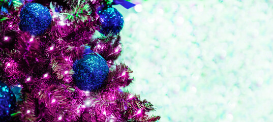 Christmas and New years eve Background. Beautiful Wide Angle Holiday Template Christmas blue lilac balls on fir tree and highlights. Panoramic classic header Web banner with copy space background.