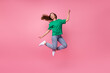 Full size photo of overjoyed cheerful girl jumping have good mood isolated on pink color background