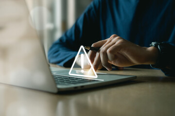 Businessman using computer laptop with triangle caution warning sing , Http 404 error not found page template concept.