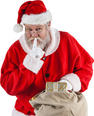 Wall Mural - image of santa claus with finger on lips holding christmas presents