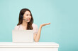 © comzeal - Young Asian businesswoman call center with headsets sitting and using laptop computer isolated over green background, Telemarketing sales or Customer service operators concept