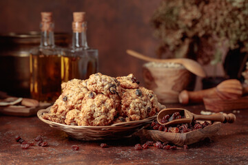 Oatmeal raisin cookies on a brown table.