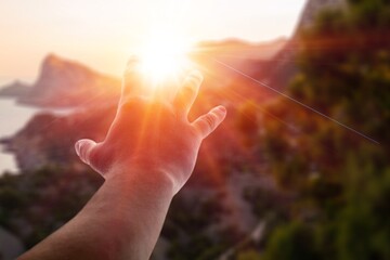 Christian person hands pray on nature background..