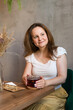 © Olena Svechkova - beautiful adult woman is sitting in a cafe. Drinking tea. Rest and pleasure.