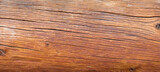 Fototapeta Kwiaty - Textured background of dry wood in the interior. Panoramic background, texture