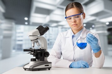 Wall Mural - happy young pharmacist do tests at laboratory