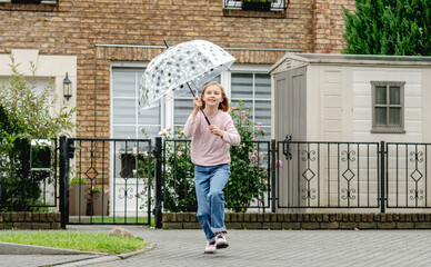 Preteen girl with umbrella