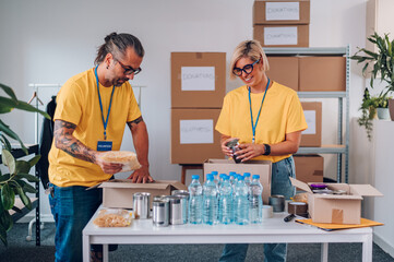 Group of volunteers working in community charity donation center