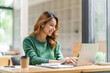 © makibestphoto - Attractive pretty asian business woman working on laptop at workstation office workplace.