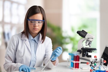Wall Mural - happy young pharmacist do tests at laboratory