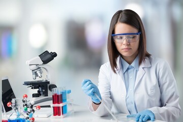 Wall Mural - happy young pharmacist do tests at laboratory
