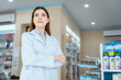© 2B - A female pharmacist looking at the camera in a pharmacy
