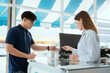 © 2B - Pharmacist Chayong standing and talking to the patient Buying medicines with a credit card online spending