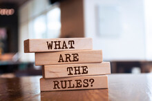 Wooden Blocks With Words 'What Are The Rules?'. Business Concept