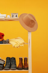 Wall Mural - Wooden shelving with clothes, concept of autumn season clothes