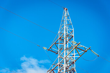 Wall Mural - Electrical net of poles on a blue sky and clouds.Summer bright sunny day.