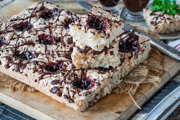 Sticker - Coconut and blackcurrant jam macaroon traybake with chocolate drizzle