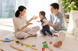 © Blue Jean Images - Young parents playing with baby at home