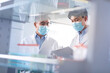 © Blue Jean Images - Researchers discussing in laboratory