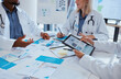 © Mumtaaz Dharsey/peopleimages.com - Healthcare doctors and meeting documents with tablet data for business discussion in office. Medical paperwork communication and analytics improvement for development of medicare company.