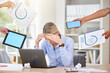 © Mumtaaz D/peopleimages.com - Stress, demand and woman worker with hands holding business reports and blank technology screens. Anxiety, overwhelmed and tired person unhappy with corporate career pressure and deadline.