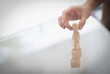 © Caia Image - Close up hand of man stacking wooden pieces